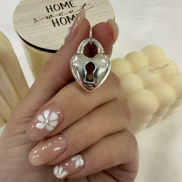 Dije a corazon con llave inflado