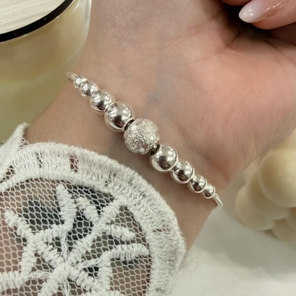 PULSERA GENIUS (cola rata con bolas)