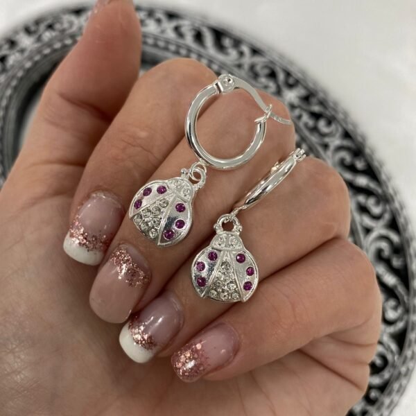argollas con dije cubic buzz