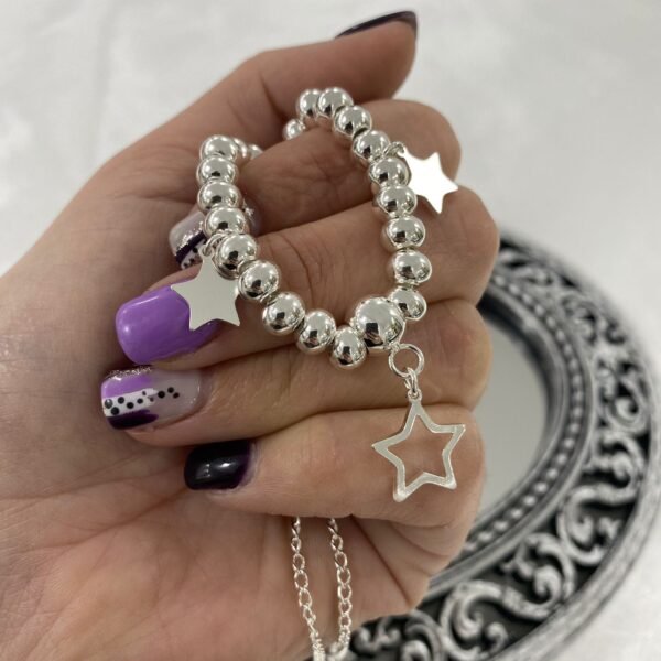 a conjunto gargantilla bolas y estrellas 2