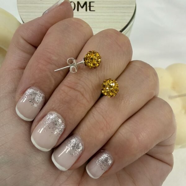 aros pasante bola fuego dorada 6mm