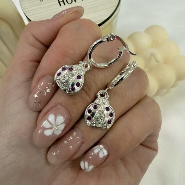 argollas con dije cubic buzz