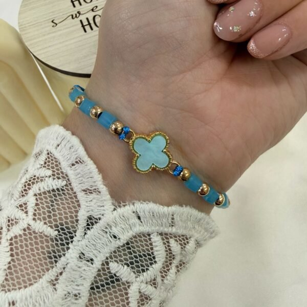 pulsera Van CL 2 ajustables con bolitas facetadas doradas celeste