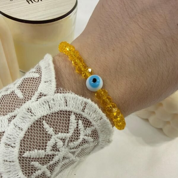 pulsera amarilla extensible con ojito