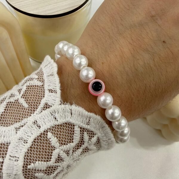 pulsera perla blanca rosa ojito