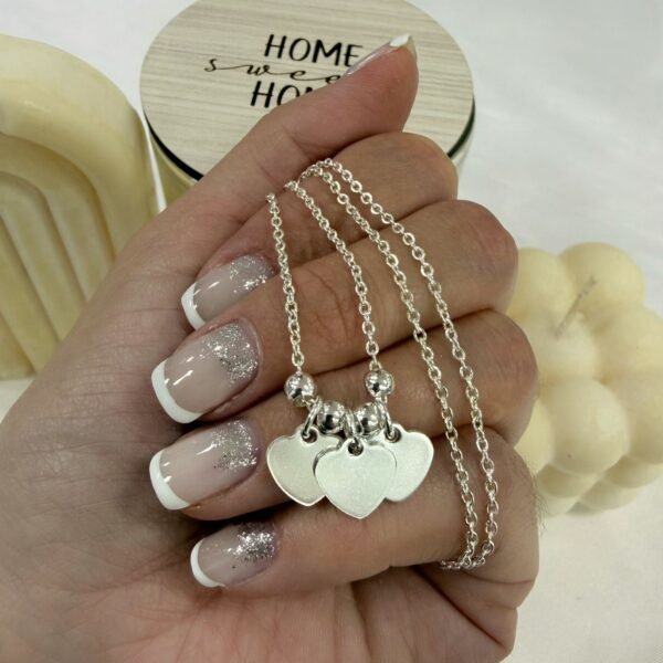 a conjunto cadena corazon triple con bolitas