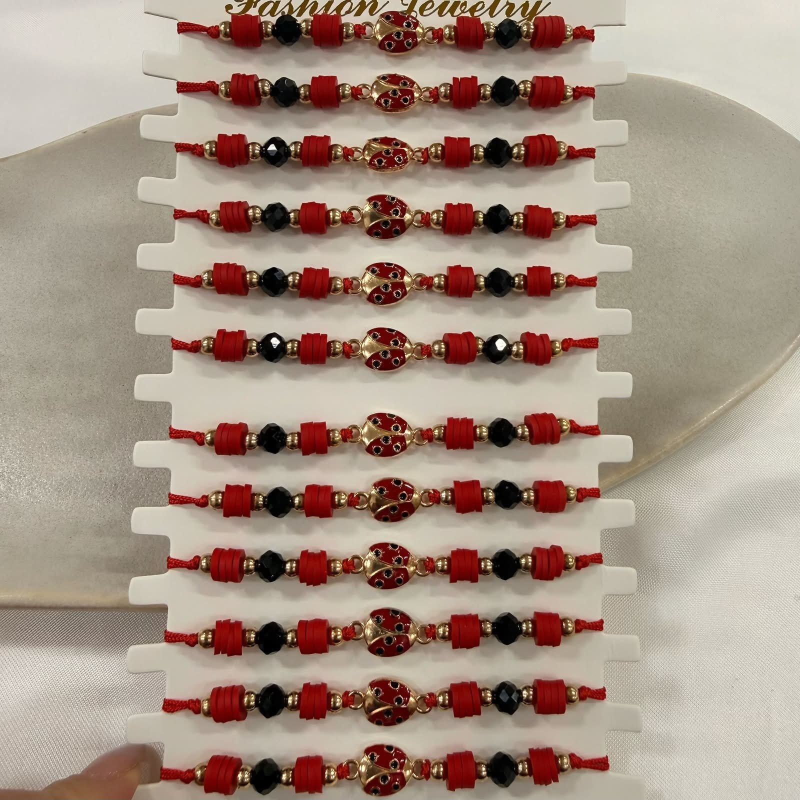 pulsera Van CL 5 vaquita ajustables con bolitas facetadas x 12 unidades