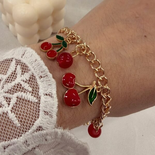 a 0 set x pulsera con dije cherry dorada modelo E