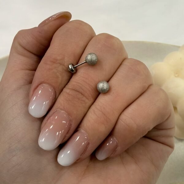 Alternative view of a a blister x 12 pares abridores mod bolita facetada a.q
