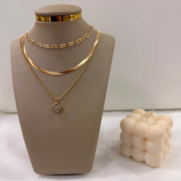 a 0 set x cadenas triples doradas modelo M