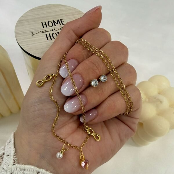 conjunto con dije infinito cubic y aros dorado