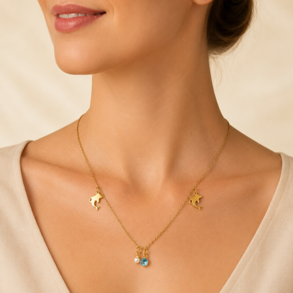 conjunto con dije dolphin cubic y aros dorado