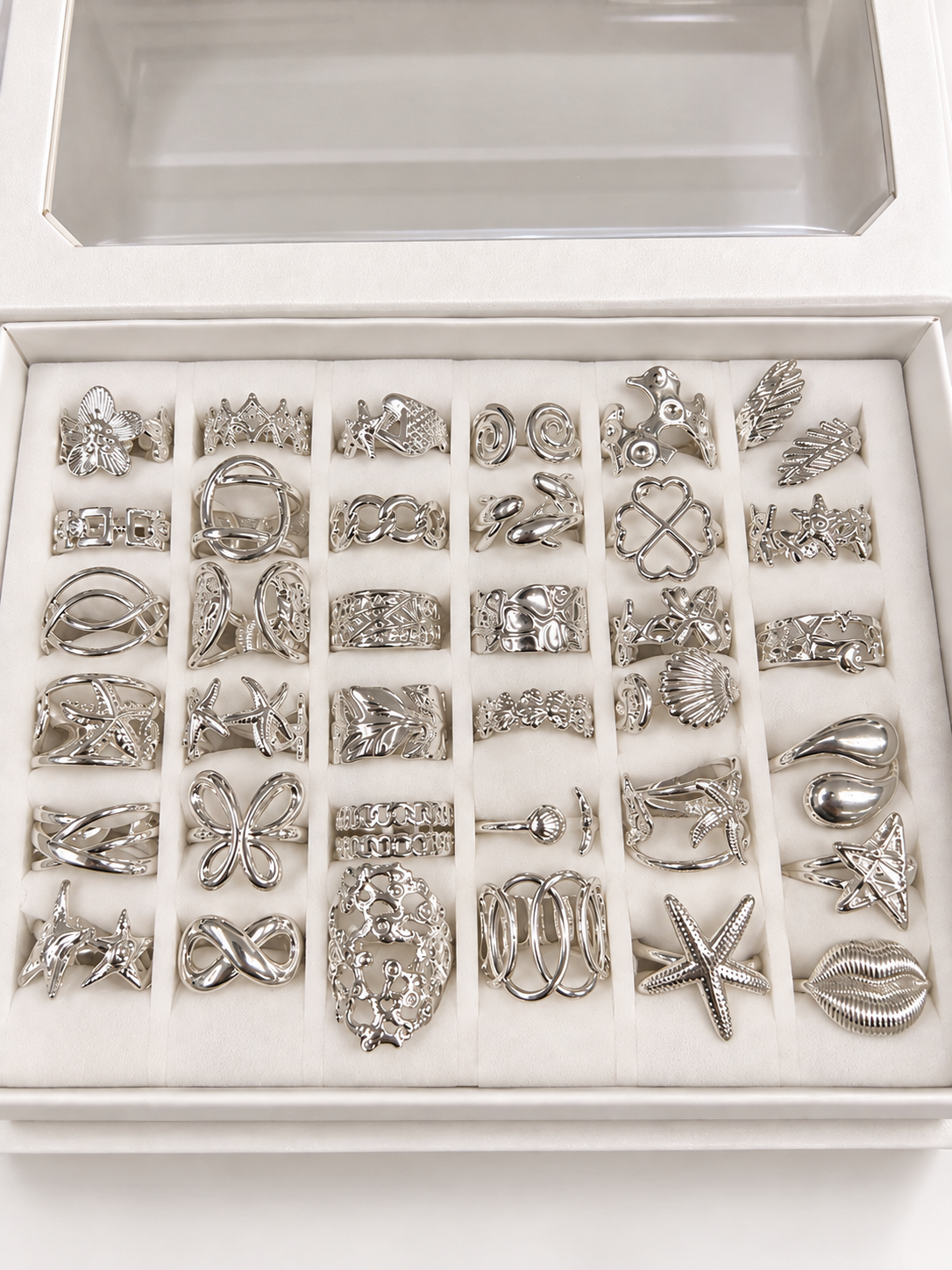 a a kit CAJA x 36 anillos regulables ACERO BLANCO con caja de regalo mod 7