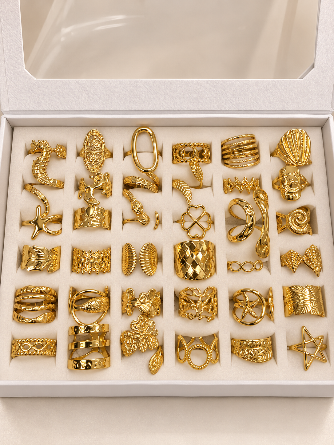 a a kit CAJA x 36 anillos regulables ACERO DORADO con caja de regalo mod 4
